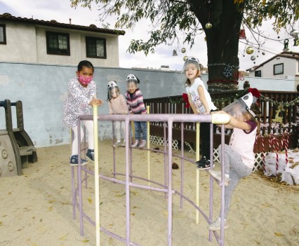 Children playing outside on playground equipment