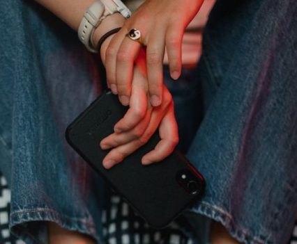 A closeup of hands holding a phone