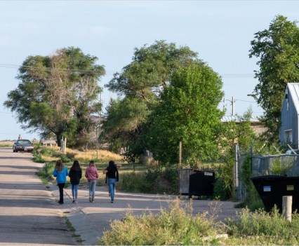 A group of girls walk down the street on the Pine Ridge Indian Reservation in South Dakota on July 22, 2021