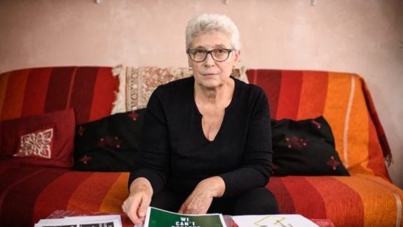 Claude Mangin, shown at her home in suburban Paris, has been waging an international campaign to win the freedom of her husband, political activist Naama Asfari, who has been jailed in Morocco for more than a decade. Her iPhone 11 was hacked last month with Pegasus spyware.