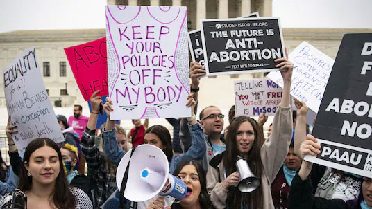 Abortion rights advocates and antiabortion demonstrators gather outside the U.S. Supreme Court on May 3.