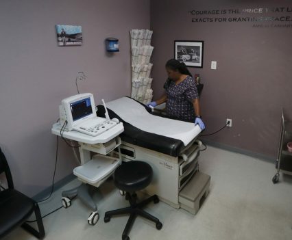 Marva Sadler, director of clinical services at Whole Woman's Health in Fort Worth, prepares an operating room at the abortion clinic.