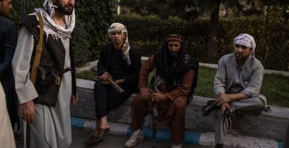 Taliban members in Kabul, Afghanistan, on Sunday. As the militants moved into the capital, police posts were abandoned and posters of women at beauty salons were painted over