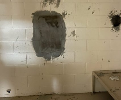 A damaged and bare cell in a juvenile detention facility