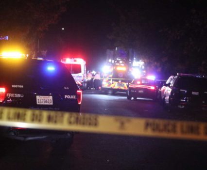 Police and emergency vehicles are on the scene Sunday, Nov. 17, 2019, of a massing shooting in southeast Fresno, Calif. At least nine people are reported to have been shot, and police said "several individuals" were killed.
