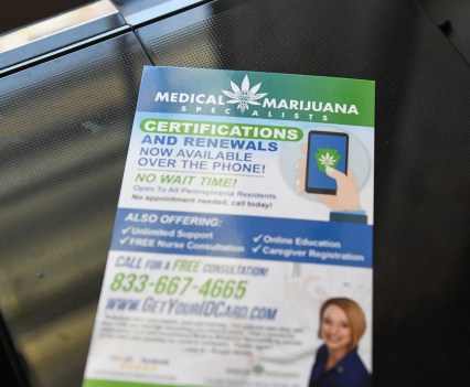 A paper advertisement for obtaining a medical marijuana card