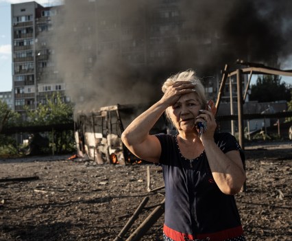 Resident of Mykilaiv chatting via phone and sharing news about the attack. In the evening of July 23, Russians fired 4 rockets Kalibr to the civilian neighbourhood in Mykolaiv, Ukraine. As a result of the attack, 4 people were injured, and residential houses, school and vehicles destroyed.