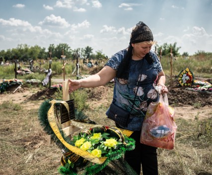 Natalya Tarasenko visits grave of hew husband Vladislav, who was killed 10 days ago as he was fighting with Russians near his home town of Kramatorsk, Donbas region of Ukraine. He was burried here just yesterday.