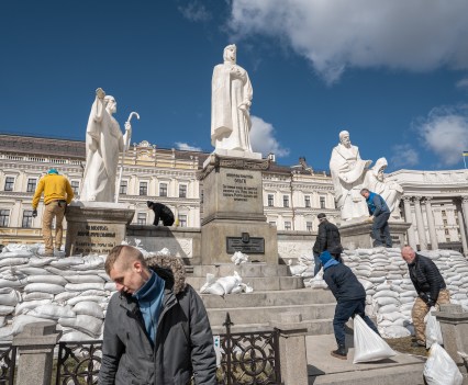 Volunteers covering the Grand Princess Olga of Kyiv monument with the sandbags in attempt to protect it from the damage caused by potential russian strikes.