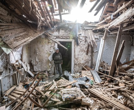 Yura showing around her burned house in Fenevichy, Kyiv region of Ukraine. The village suffered a short but devastating time under occupation when the Russian army was advancing towards Kyiv. Russians retreated from the Kyiv region in early April and left behind dead civilians and destruction.