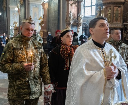 Roman, 33, soldier of the 103 Brigade of the Armed Forces of Ukraine, marrying Iryna, 37, and baptizing their child Solomiya in the Garrison Temple in Lviv, Ukraine, on March 1, 2022. Soon, Roman might leave his family and join the combat mission to protect Ukraine from the invasion of the Russian Federation.