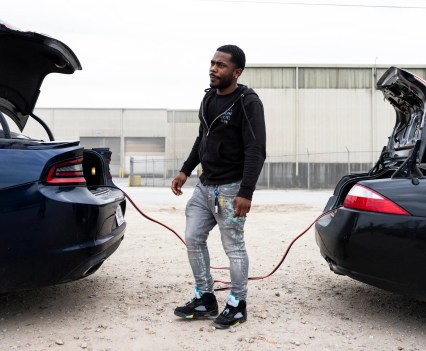 Shawn Douglas Jr. jump-started his car after recovering it from the Memphis Police impound lot.Credit...Brad J. Vest for The New York Times
