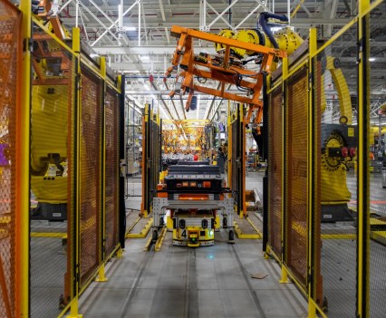Automated equipment assists workers who assemble F-150 Lightnings at Ford's Rouge complex