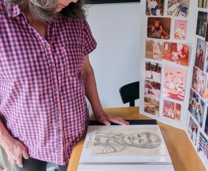 Susan Ottele looks at a sketch of her son, Adam Collier