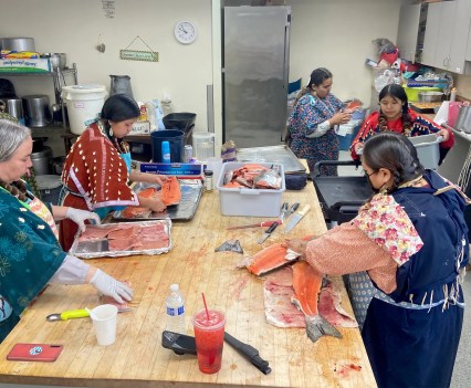 Lottie Sam, front right, and other women prepare salmon in Toppenish, Washington, before a ceremony held by the Confederated Tribes and Bands of the Yakama Nation.