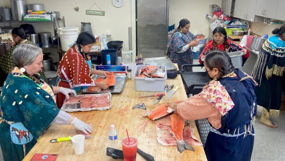 Lottie Sam, front right, and other women prepare salmon in Toppenish, Washington, before a ceremony held by the Confederated Tribes and Bands of the Yakama Nation.