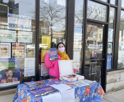 Field canvasser Leslie Hurtado tabling in Irving Park outside Alderperson Rossana Rodriguez’s office in Chicago, Ill, April 3, 2022.