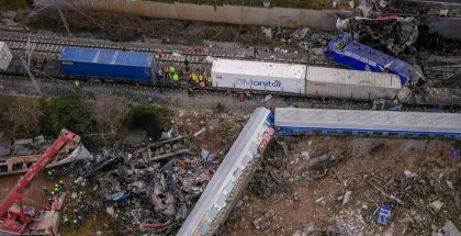 Rescue workers gather at the site of a train derailment in Greece