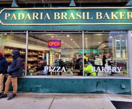 Front of a building. Sign reads, "Padaria Brasil Bakery"