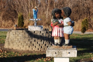 Haire carefully painted each angel statue in the garden a hue of brown. He says he wanted the angels to be Black, like many of the children laid to rest here.(CARA ANTHONY / KHN)