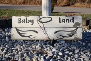 More than 30 years ago, Haire set up a birdbath and purchased angel figurines for a special garden for deceased children called “Baby Land.” (CARA ANTHONY / KHN)