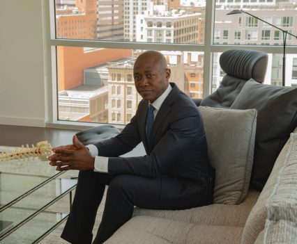 Owoicho Adogwa, a neurosurgeon at the University of Cincinnati, in his home.