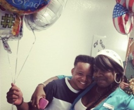 Johnny Reed and his aunt, Shawanna Chambers, celebrating his eighth grade graduation.