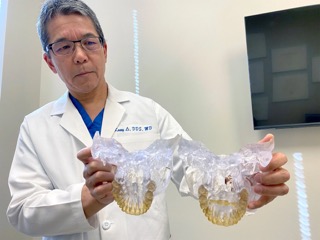 Dr. Kasey Li, a California maxillofacial surgeon, who has examined about 10 patients fitted with the AGGA and reviewed dental scans of five more, describes it as a “medieval” device. Li says his experience with the AGGA patients he has examined is that “it does nothing but basically make them lose their teeth.”(ANNA WERNER / CBS NEWS)