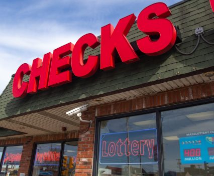 All Checks Cashed in Everett, Massachusetts, is one of nearly 150 businesses licensed by the state of Massachusetts to cash checks and sell lottery tickets. Check cashers sold nearly $36 million in lottery products from 2017 through 2020. (Garrett Adamtsev/Boston University)