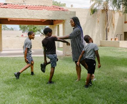 Tyra Smith with three of her sons at their apartment complex in suburban Mesa, Arizona