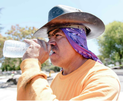 Roy Alvarado with Goodline Landscaping of Tracy takes a drink while working on a playground renovation in Livermore in 2019.