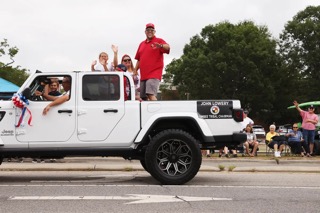 Supporters of U.S. Senate candidate Ted Budd ride a parade route during the 2022 Lumbee Homecoming in Pembroke. (Travis Dove for The Assembly)