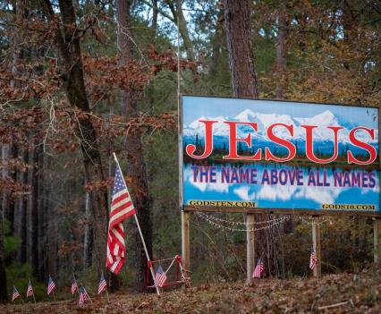 A homemade billboard along Farm to Market Road 83 outside of Hemphill on Dec. 30, 2022. In this region of the state, religion is entangled in community life and conversations about sex education.