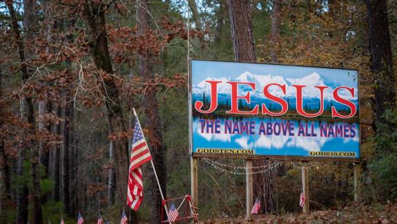 A homemade billboard along Farm to Market Road 83 outside of Hemphill on Dec. 30, 2022. In this region of the state, religion is entangled in community life and conversations about sex education.
