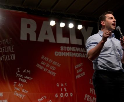 Man with a microphone makes a speech during a rally