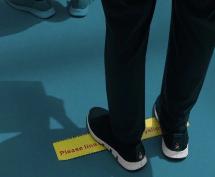 Illustration of feet standing on a yellow line