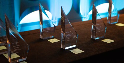 A series of OJA trophies sitting on a table.
