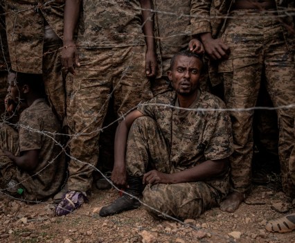 Ethiopian National Defense Forces soldiers are held at a camp for an estimated 3,000 prisoners of war after being captured last week by Tigray Defense Force rebels during fighting south of the city of Mekelle in Ethiopia's northern Tigray region on June 23, 2021.