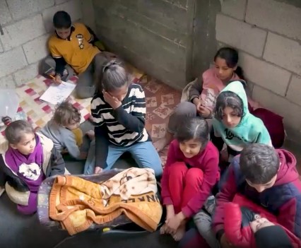 Photo of a group of young children huddled together