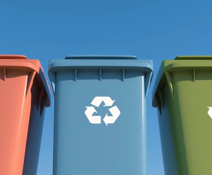 Photo of three different colored recycling bins side-by-side