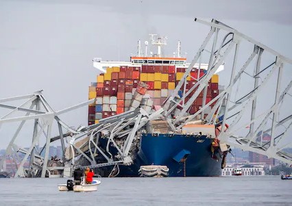 Photo of a ship hitting a bridge