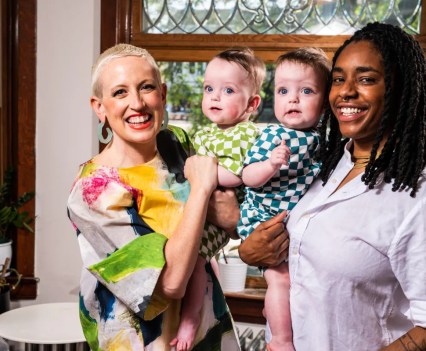 Kristen Kaza and Alexis Jennings pose for a photo with their one-year-old twins Nova and Jade in their Logan Square home on May 21, 2023.