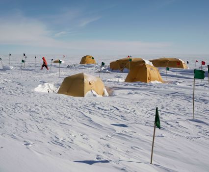 Tan tents across a snowy landscape