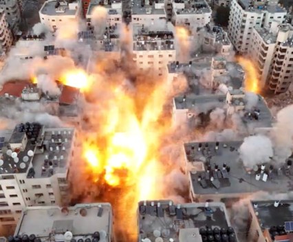 A large explosion in the midst of city buildings