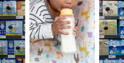 Rows of boxes of formula stock store shelves in the background. Over the top is a portrait of a baby drinking from a baby bottle