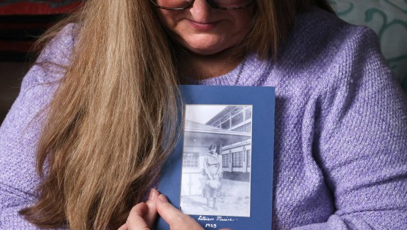 At her Auburn home, Carrie Davidson holds a photo of her great-grandmother, Lillian. (Karen Ducey / The Seattle Times)